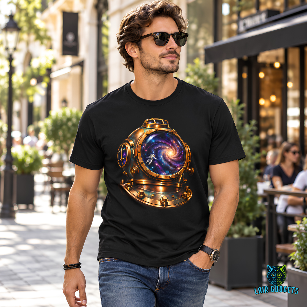Model in a black graphic tee with a brass diving helmet holding a swirling galaxy and a tiny astronaut