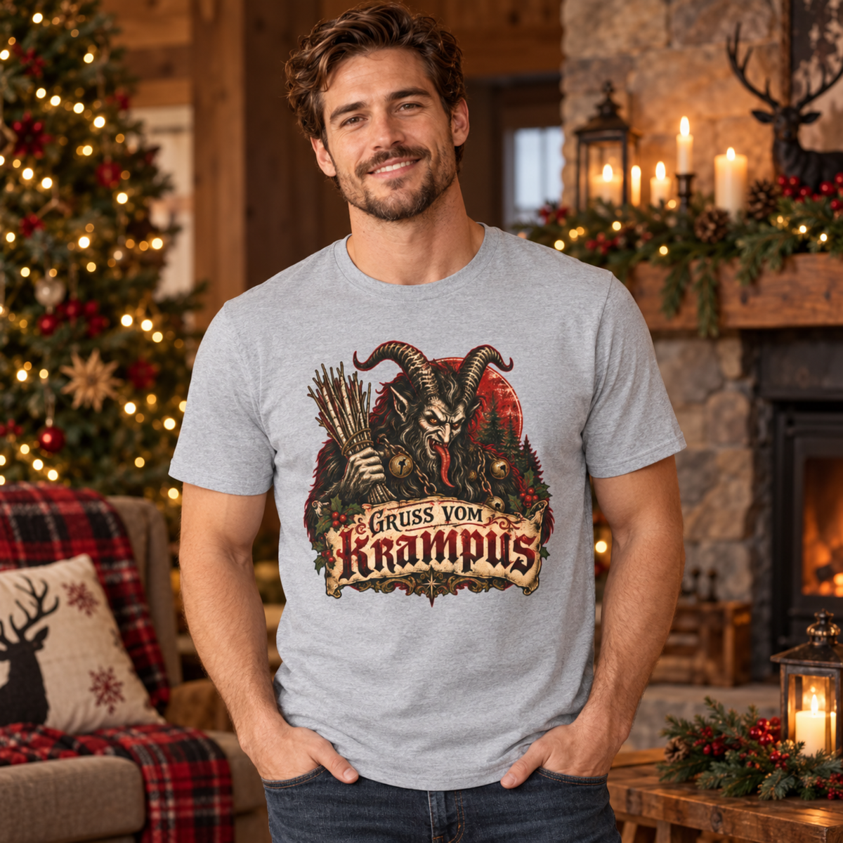 Man wearing the Sport Grey Gruss vom Krampus tee by a Christmas tree and fireplace