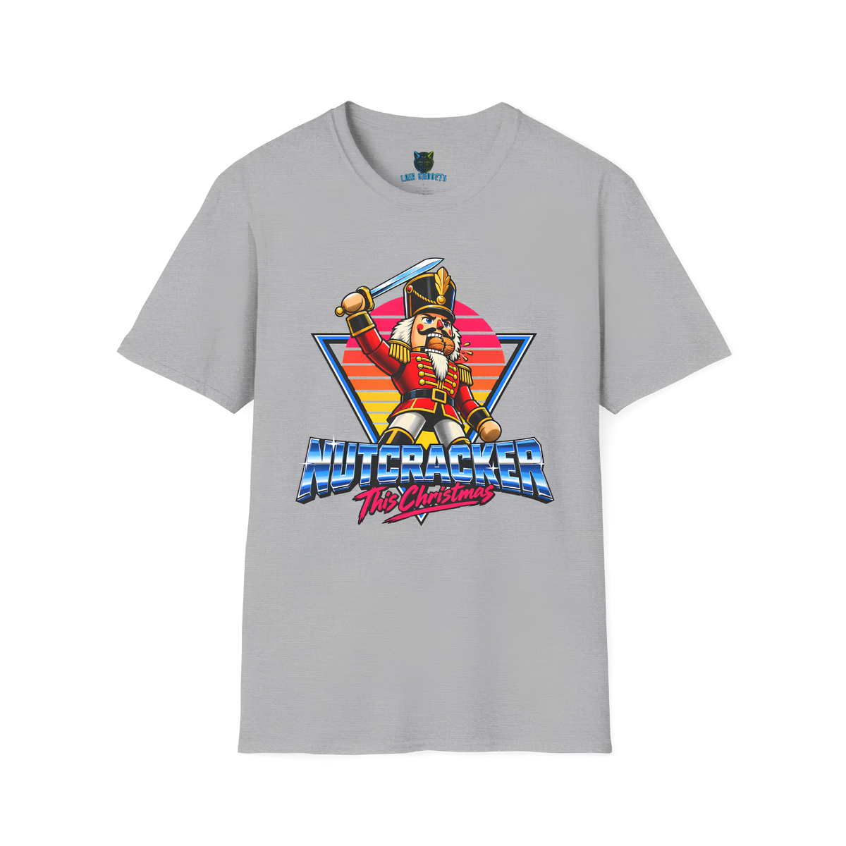 Nutcracker tee in Sport Grey: retro 80s action hero nutcracker soldier with a raised sword and a cracked walnut, chrome Nutcracker title over a neon sunset